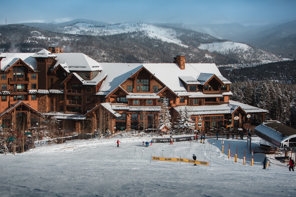 a ski lodge with a lot of snow on the ground