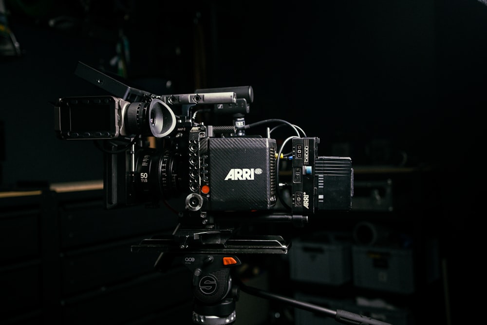 a camera set up on a tripod in a dark room