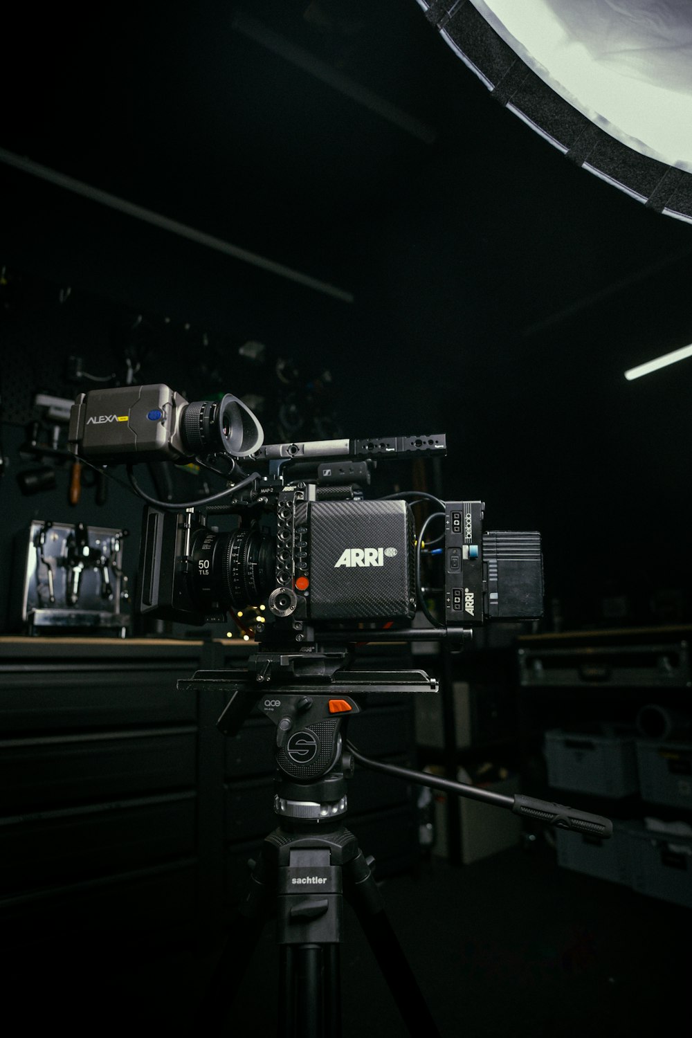 a camera set up on a tripod in a dark room
