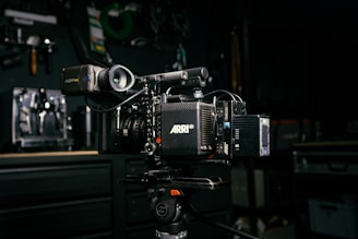 a video camera sitting on top of a tripod