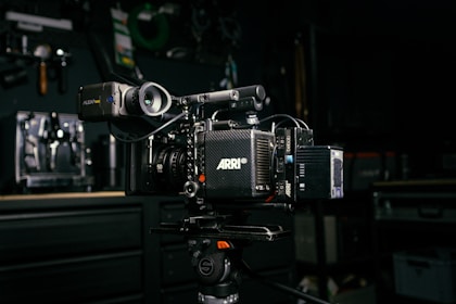 a video camera sitting on top of a tripod