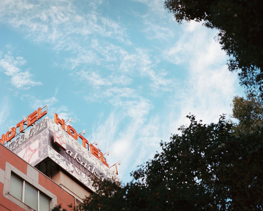 a tall building with a sign on top of it