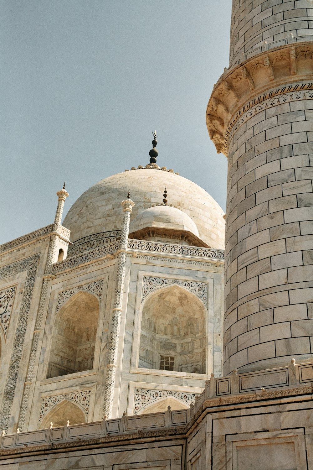 a large white building with a clock on it's side