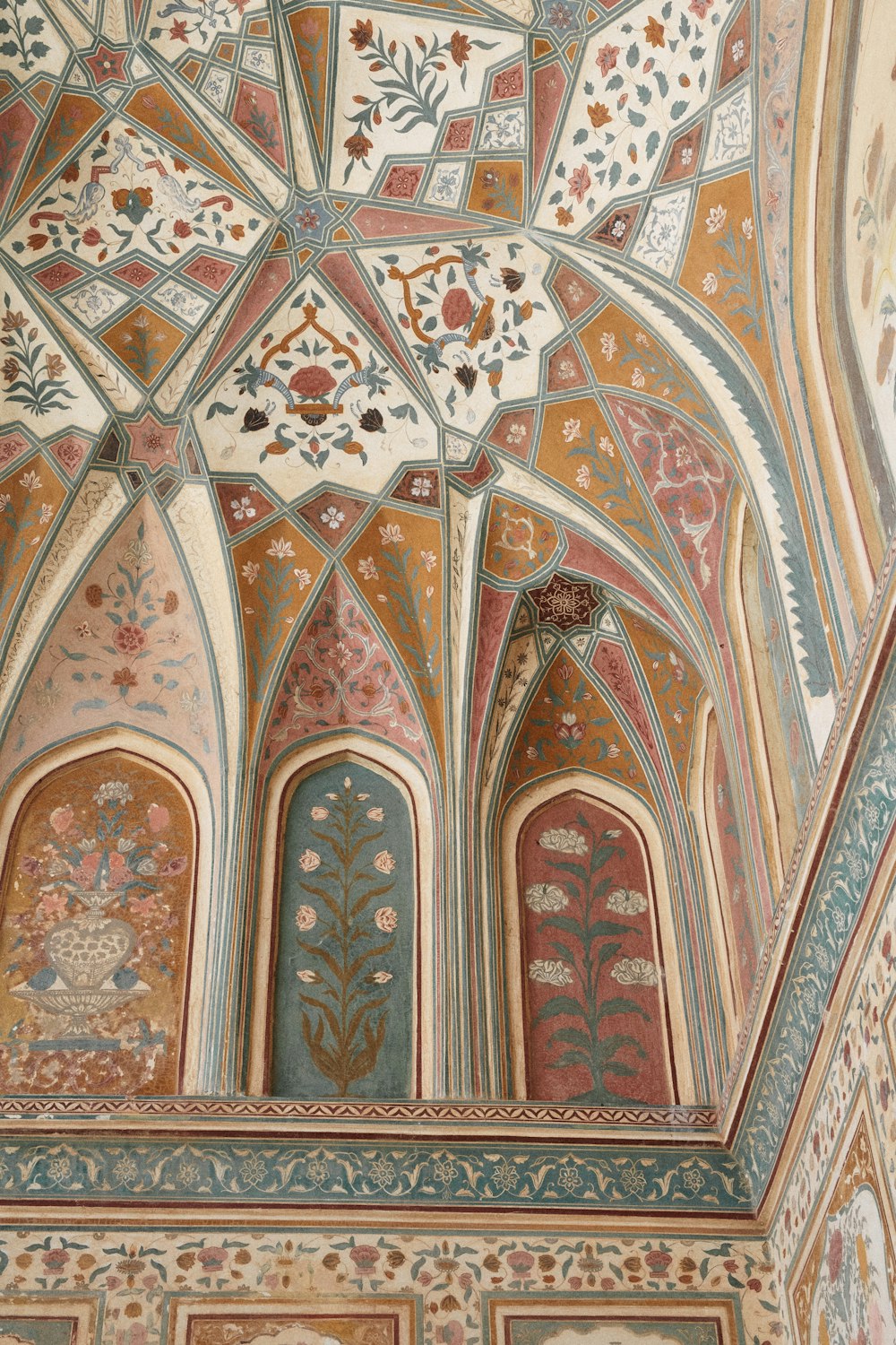 the ceiling of a building with intricate designs