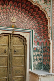 a large wooden door sitting inside of a building