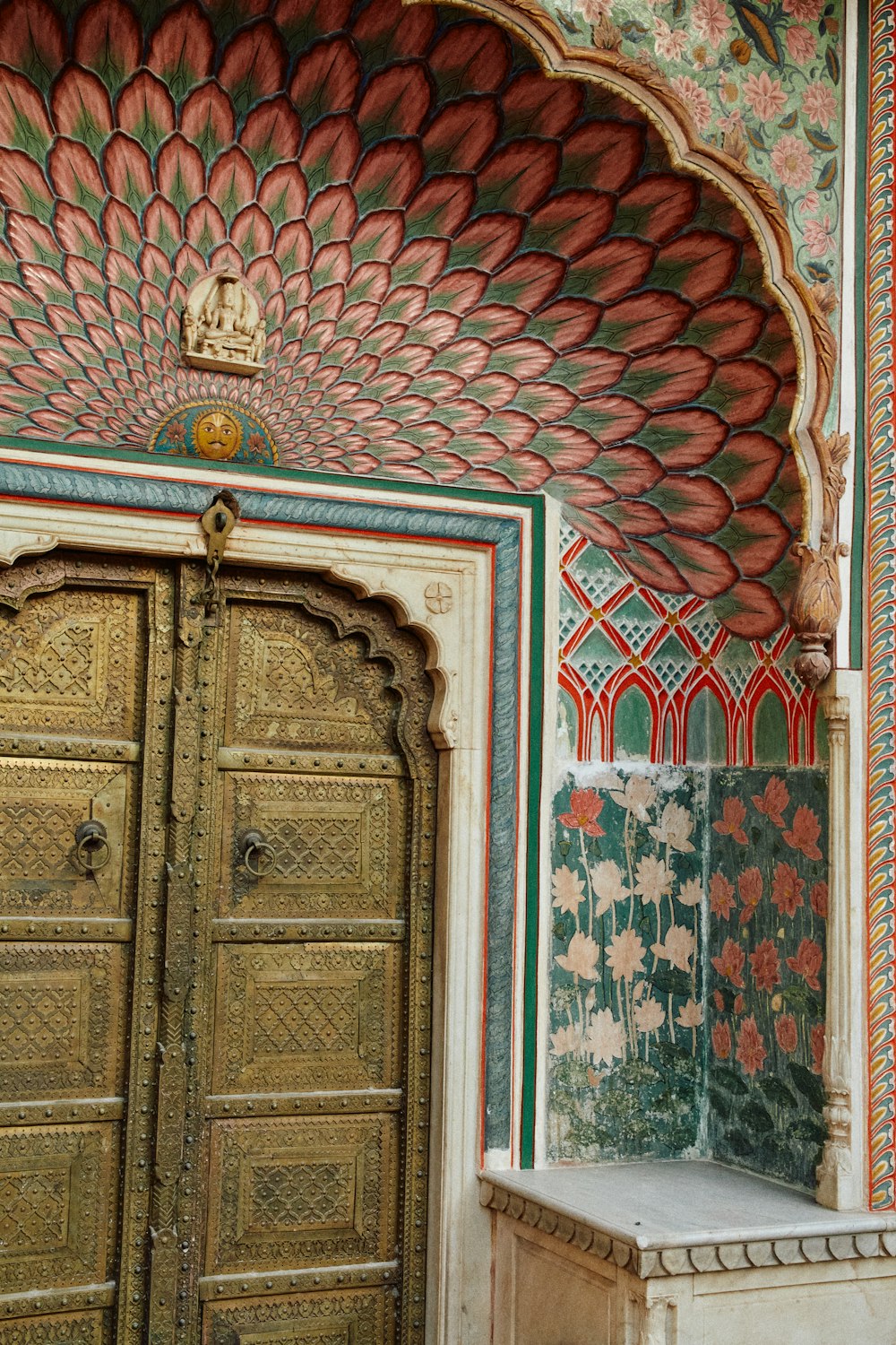 a large wooden door sitting inside of a building