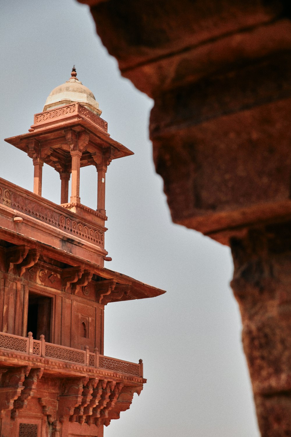 a tall tower with a clock on the top of it