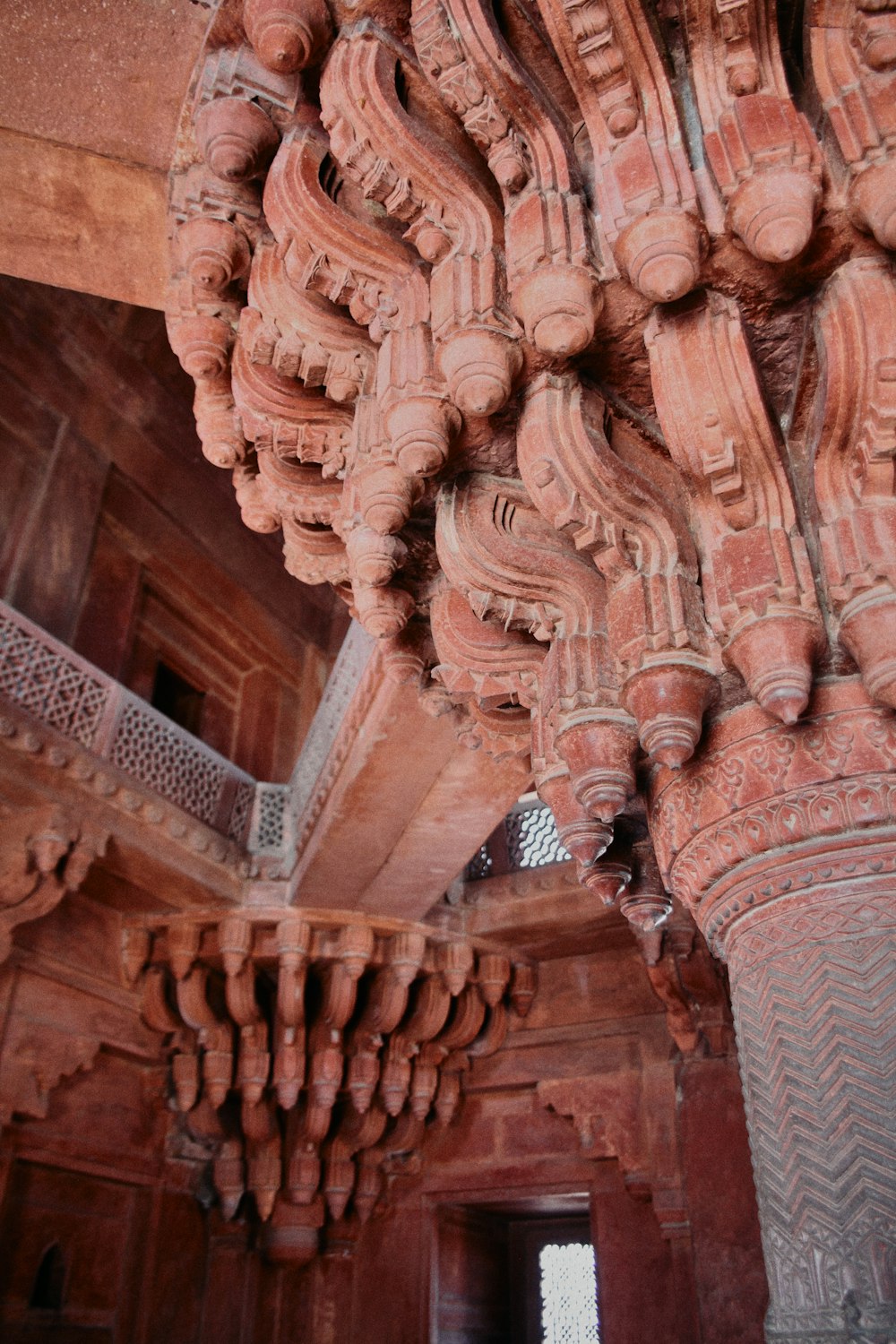 a close up of a building with a bunch of carvings on it