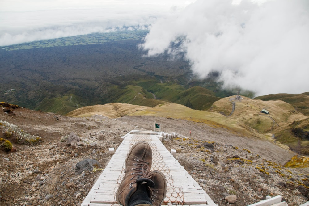 a person standing on top of a wooden platform