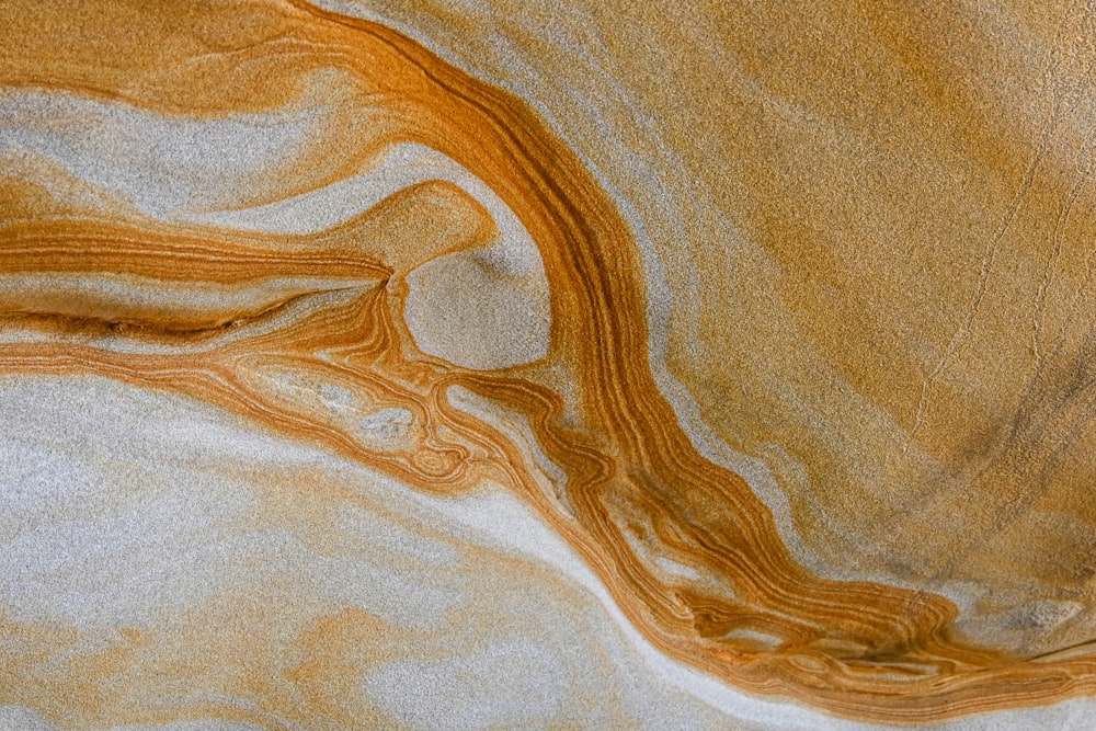 a close up of a brown and white surface