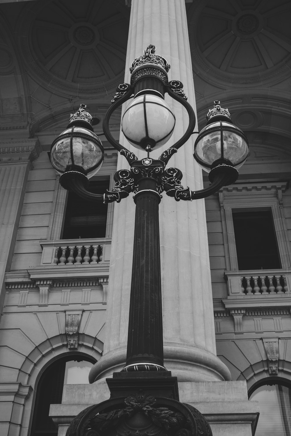 a black and white photo of a lamp post