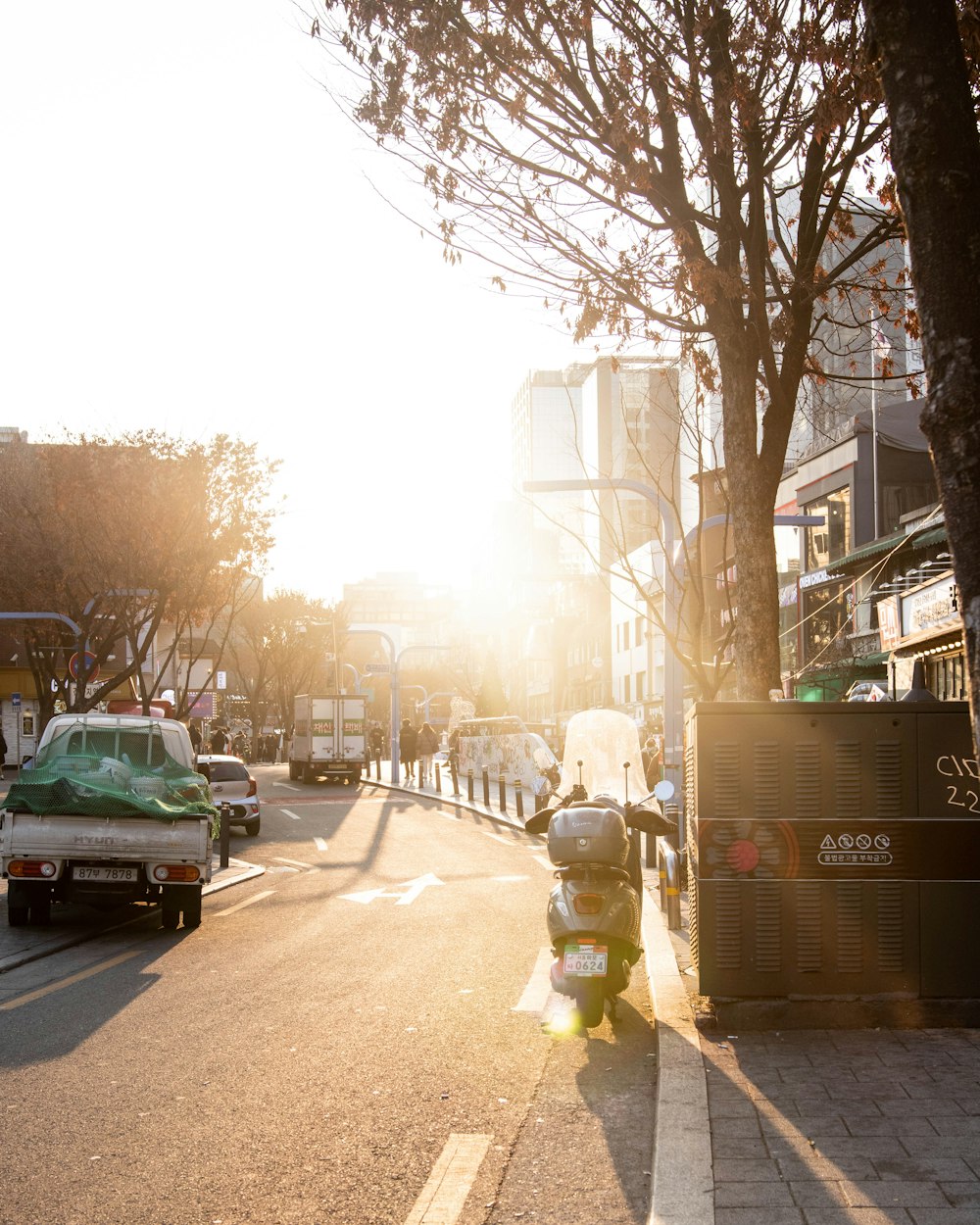 a motor scooter is parked on the side of the road