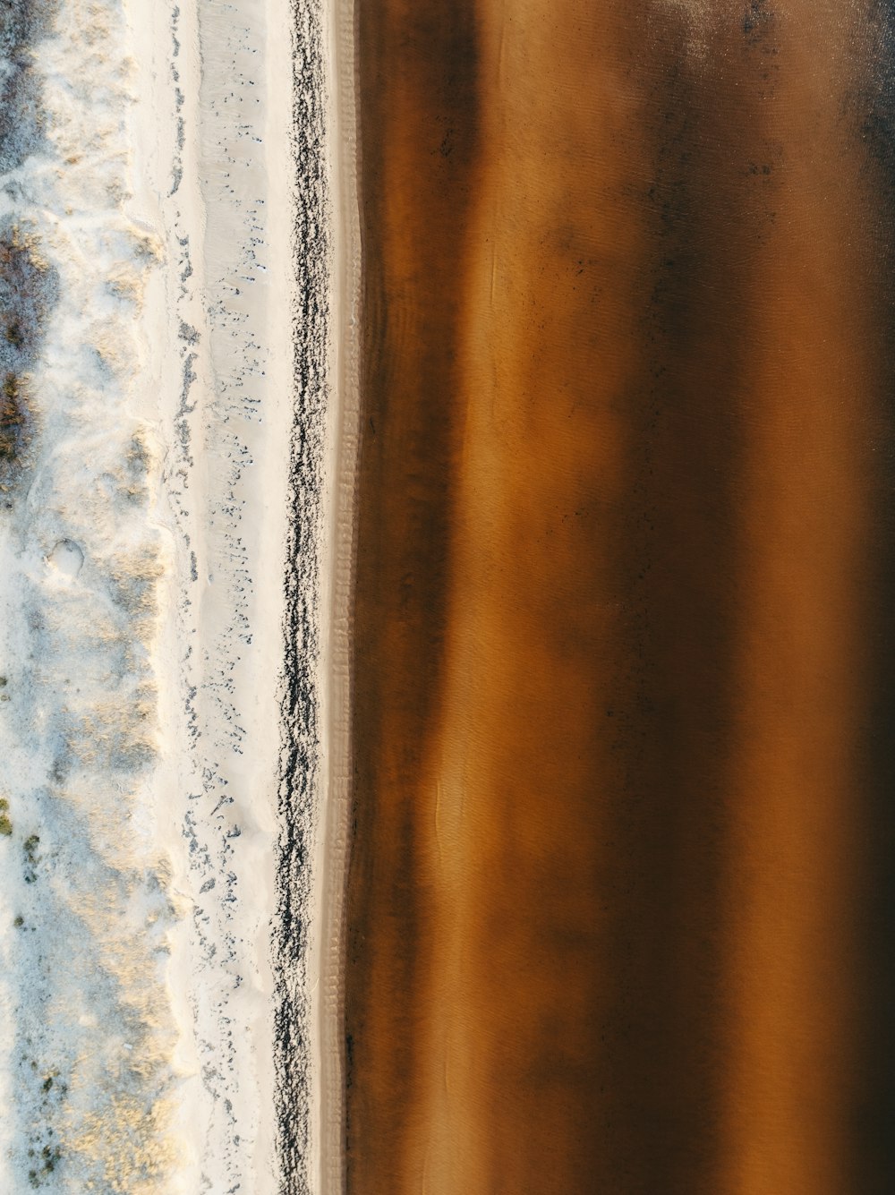 a bird's eye view of a sandy beach