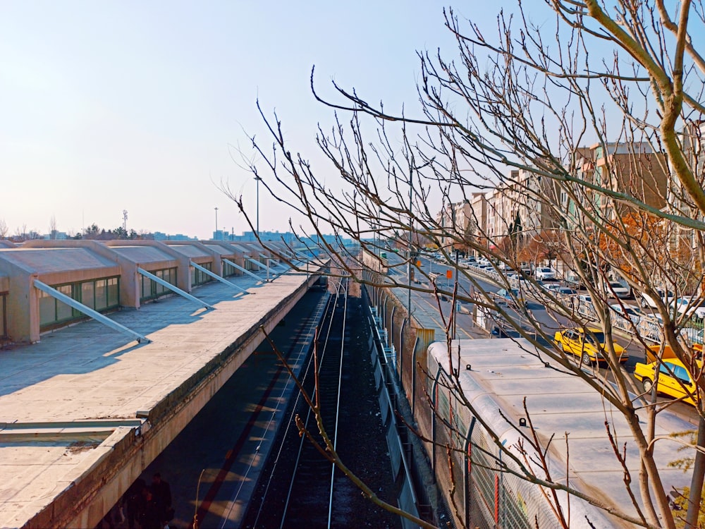 a train traveling down tracks next to a train station