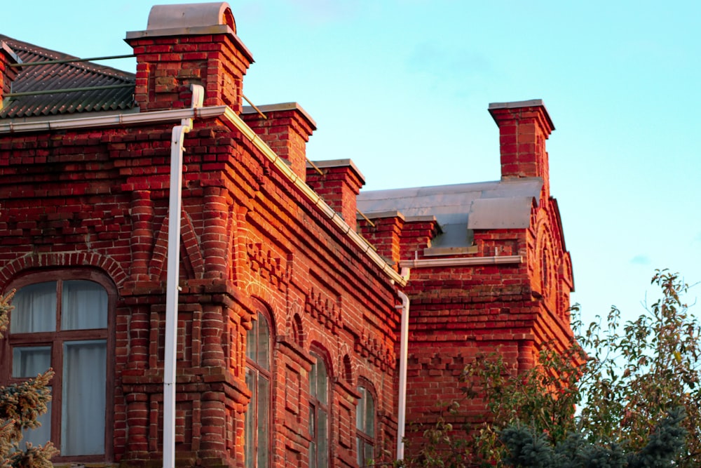 a red brick building with a clock on the front of it