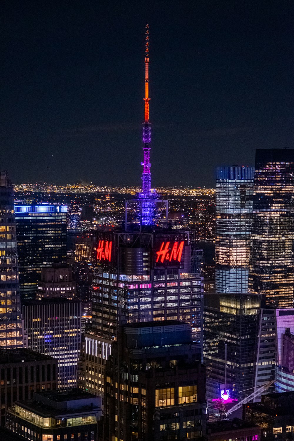 a view of a city at night from the top of a building