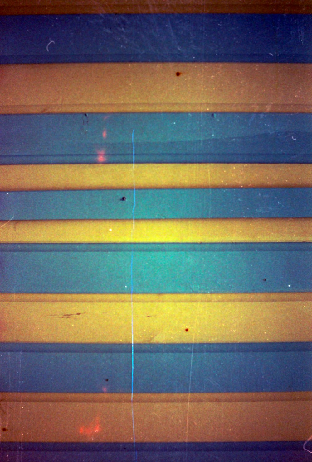 a close up of a yellow and blue striped wall
