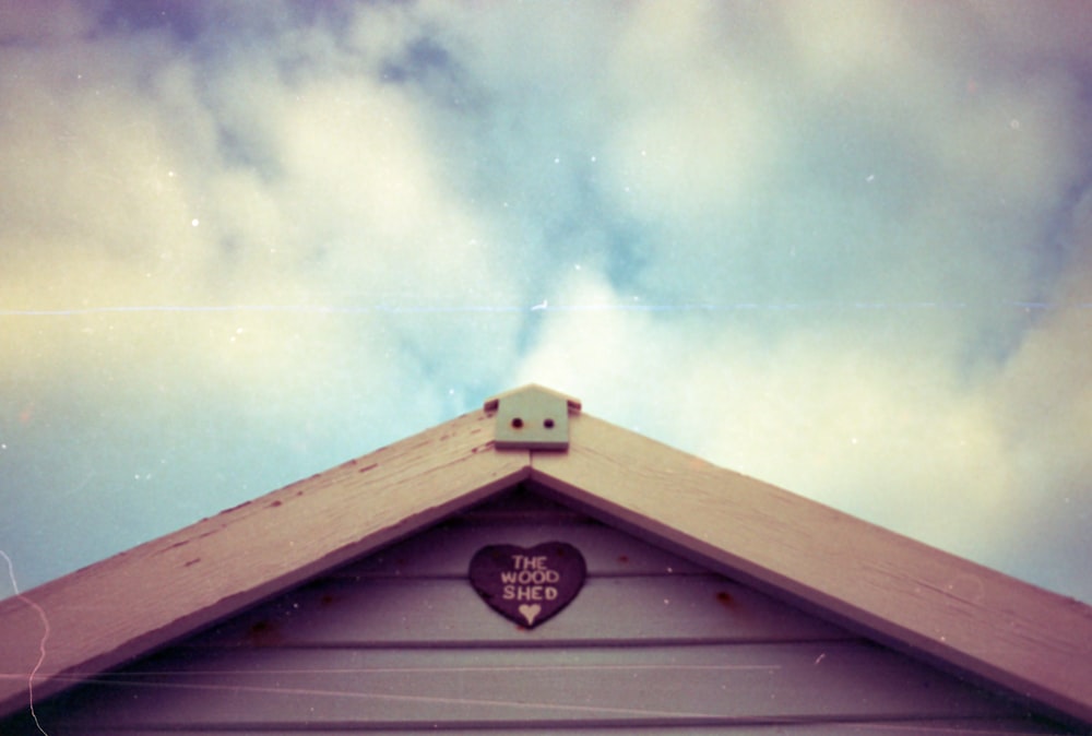 a heart shaped sign on the side of a building