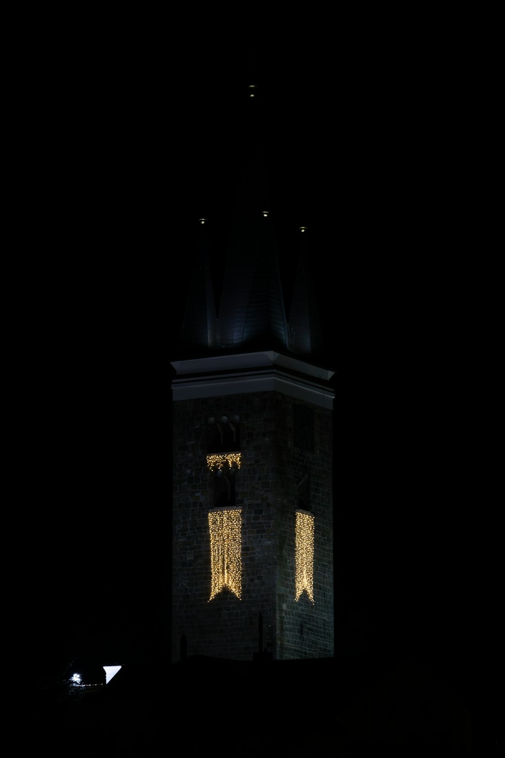 a clock tower lit up with lights at night