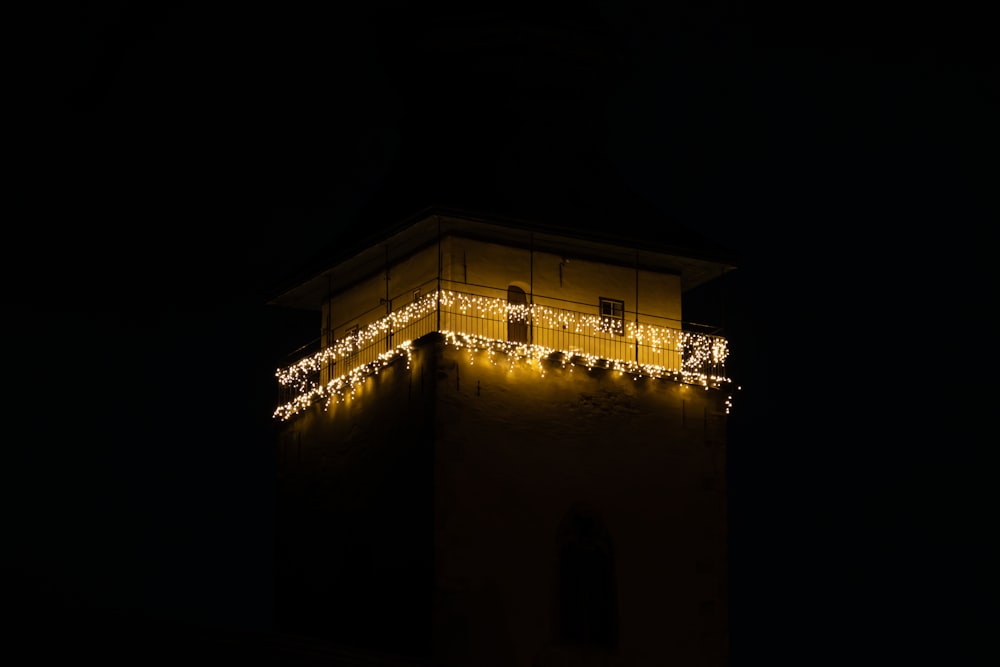 a clock tower with a lot of lights on it