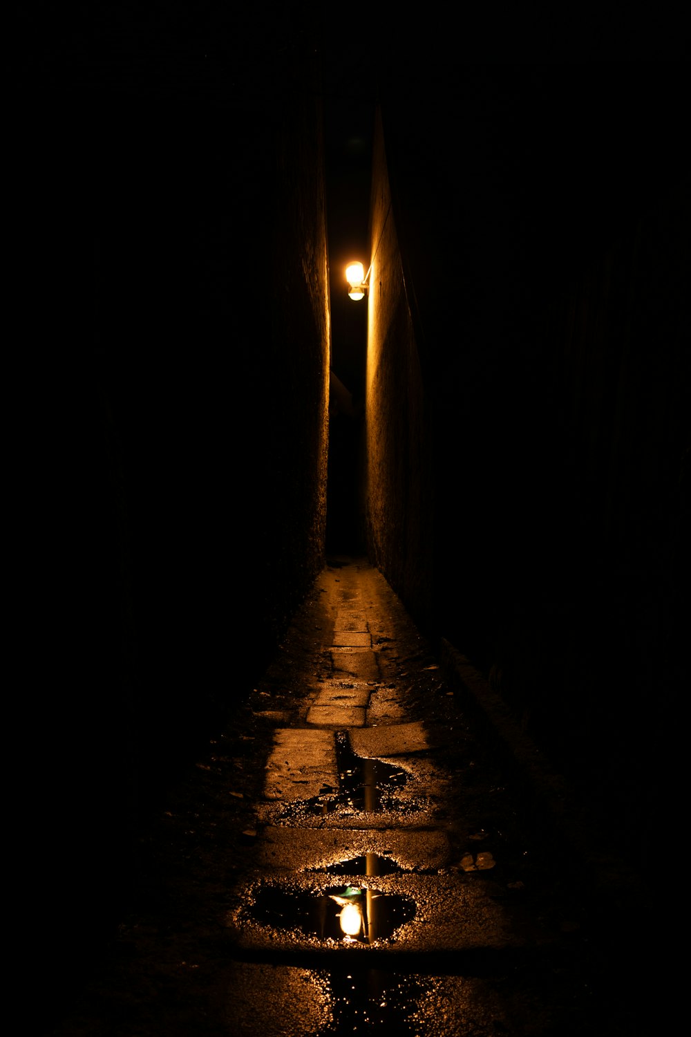 a dark tunnel with a light at the end