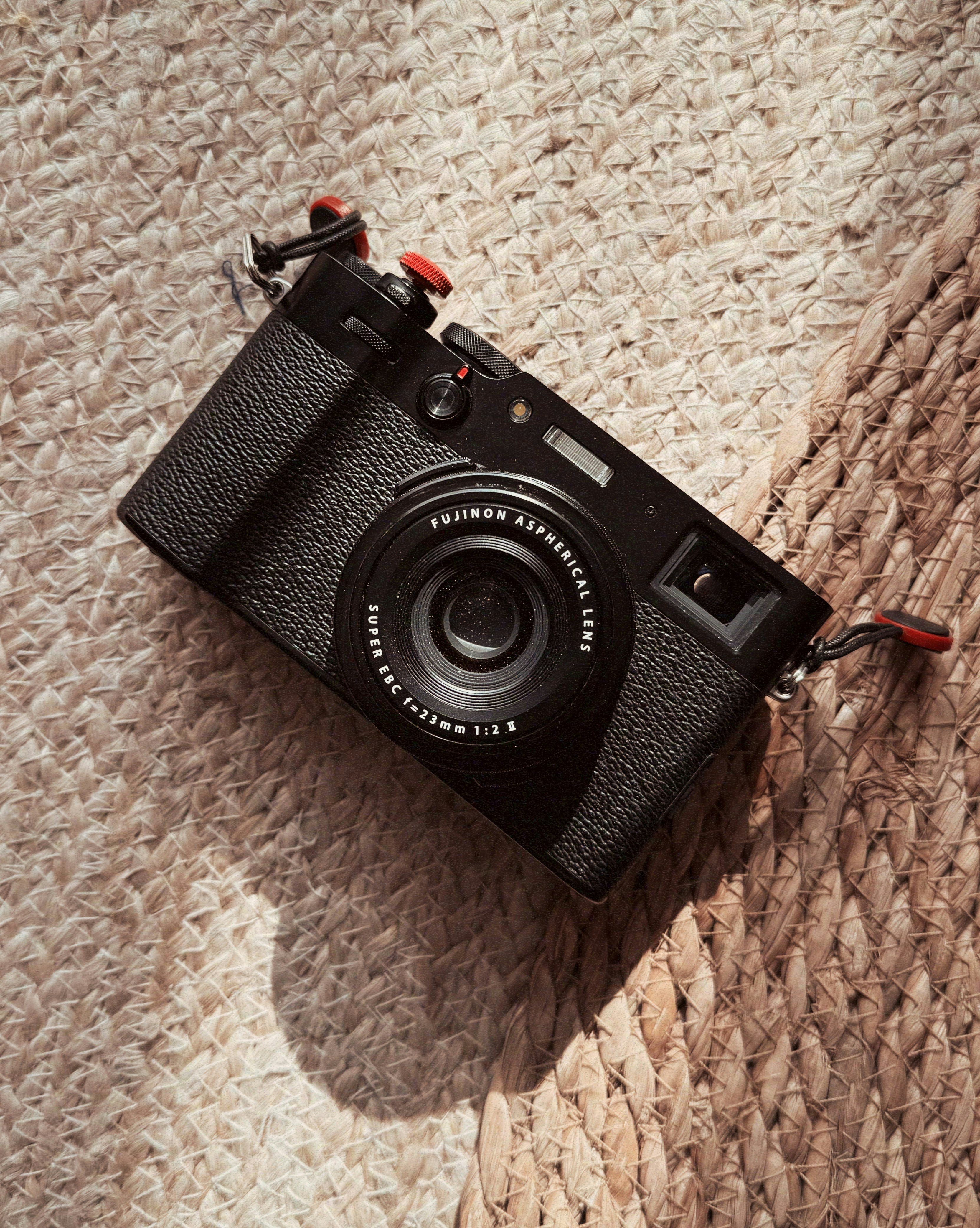 a black camera sitting on top of a rug