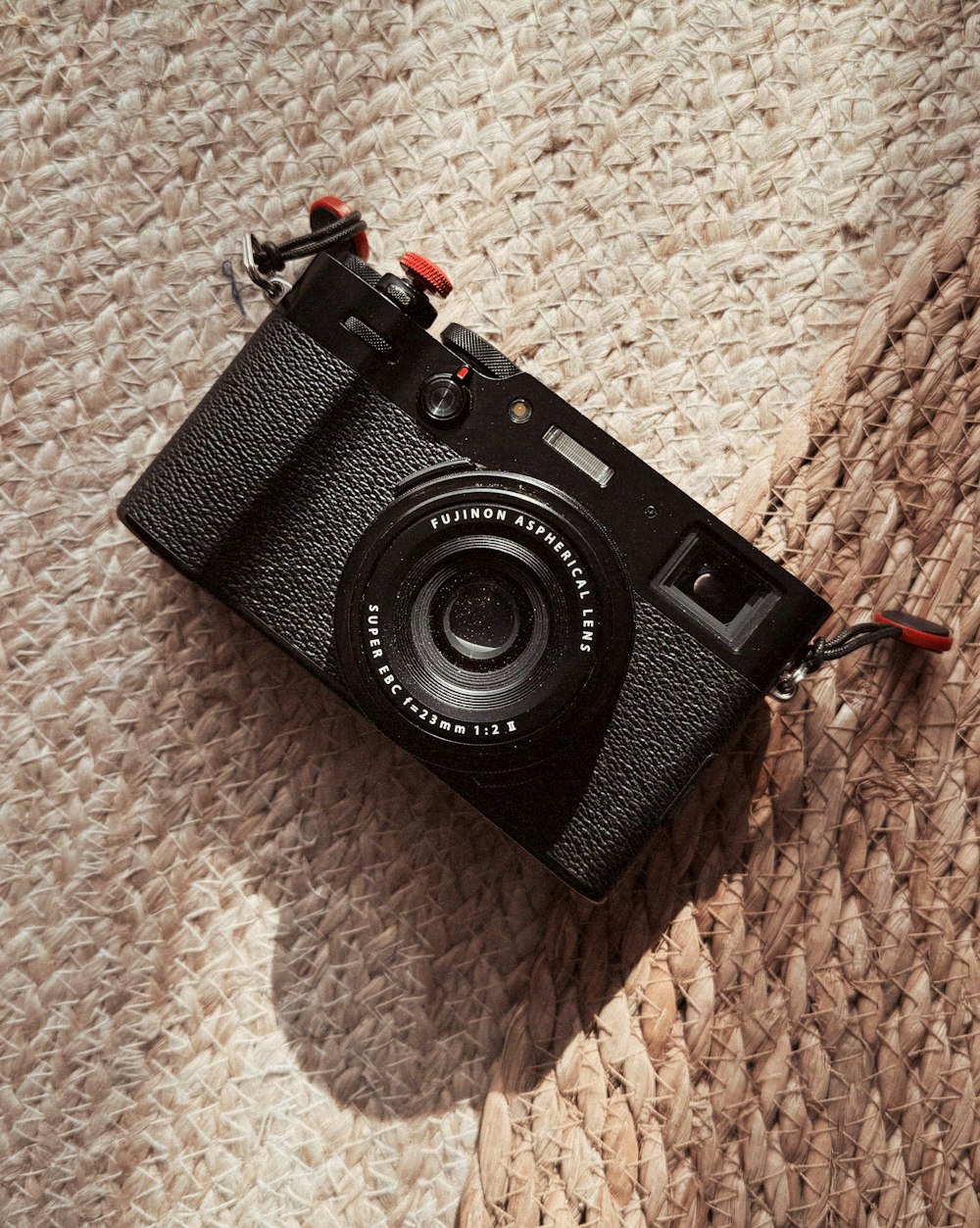 a black camera sitting on top of a rug
