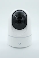 a white camera on a white surface
