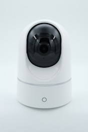 a white camera on a white surface