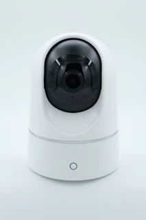 a white camera on a white surface
