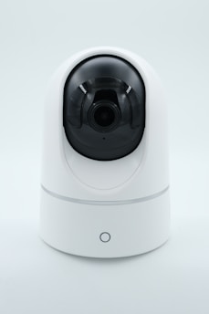a white camera on a white surface