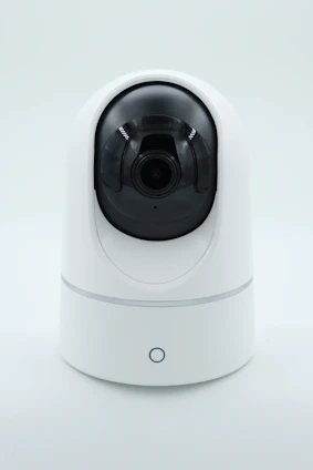 a white camera on a white surface