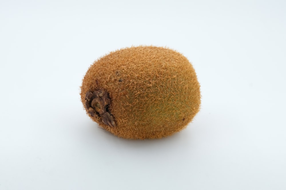 a close up of a kiwi fruit on a white background