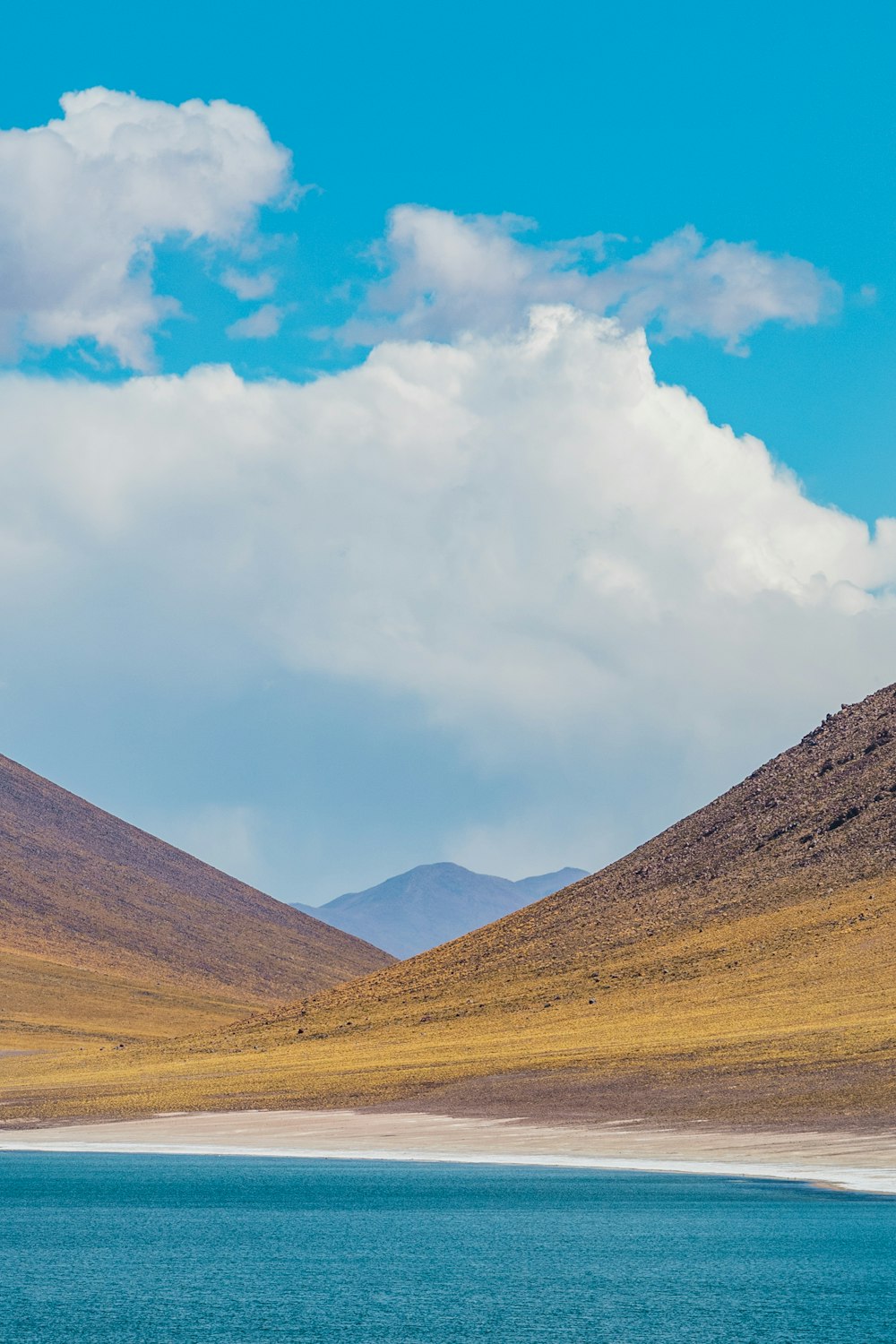 a large body of water surrounded by mountains