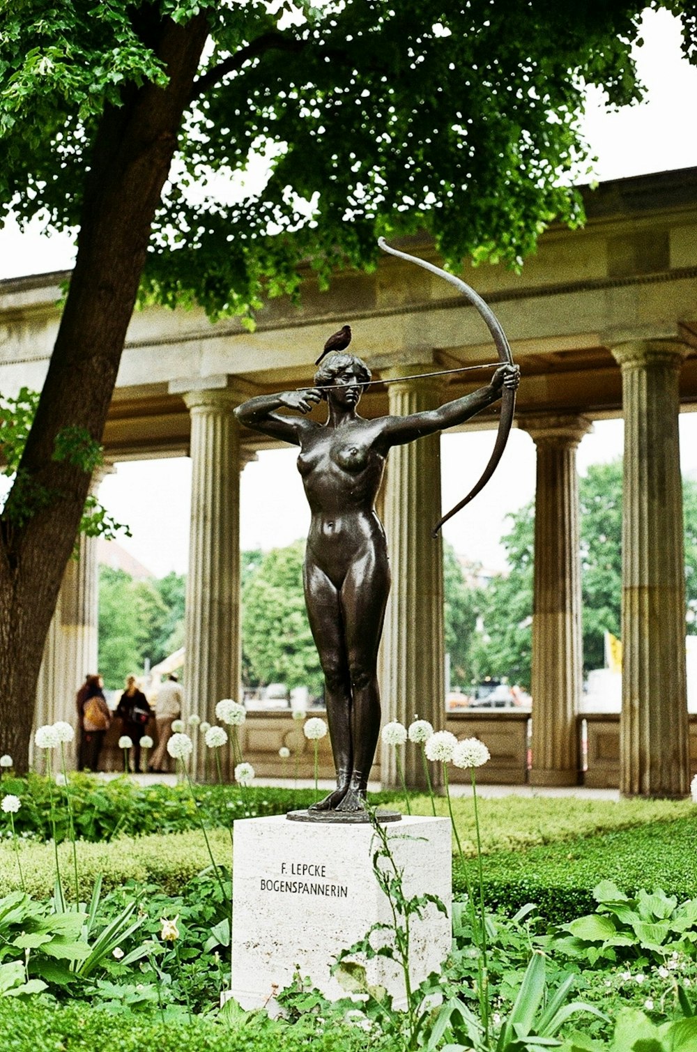 a statue of a woman with a bow and arrow
