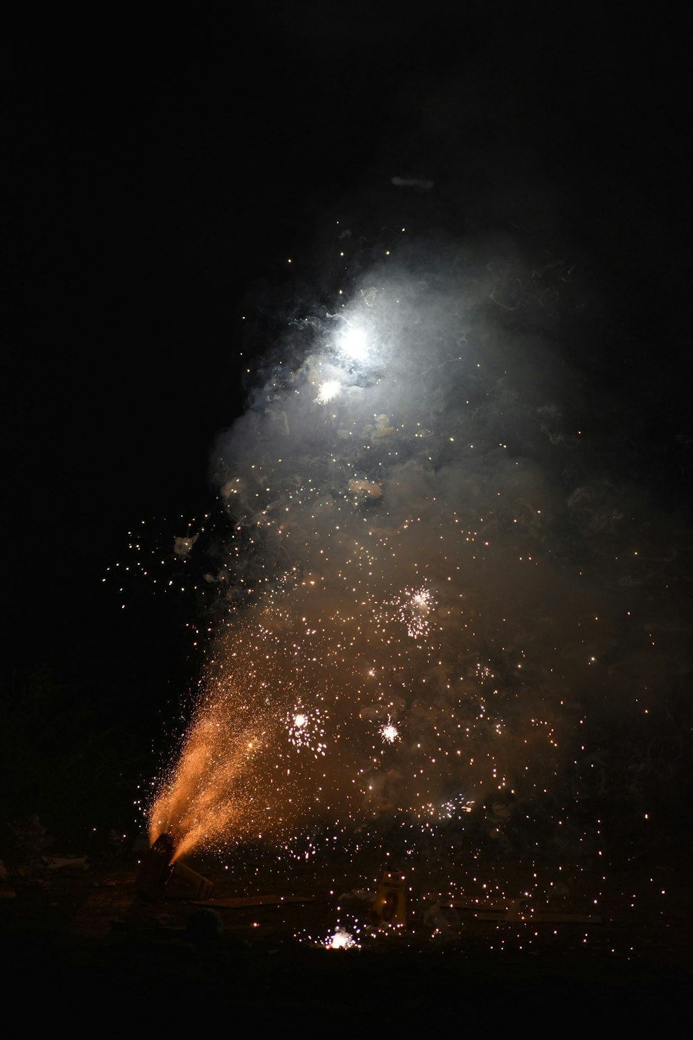 a fireworks is lit up in the night sky