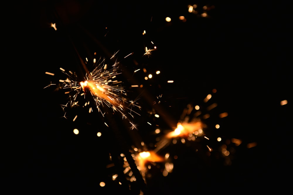 a close up of a sparkler in the dark