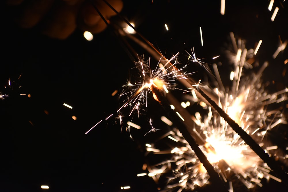 a person holding a sparkler in their hand