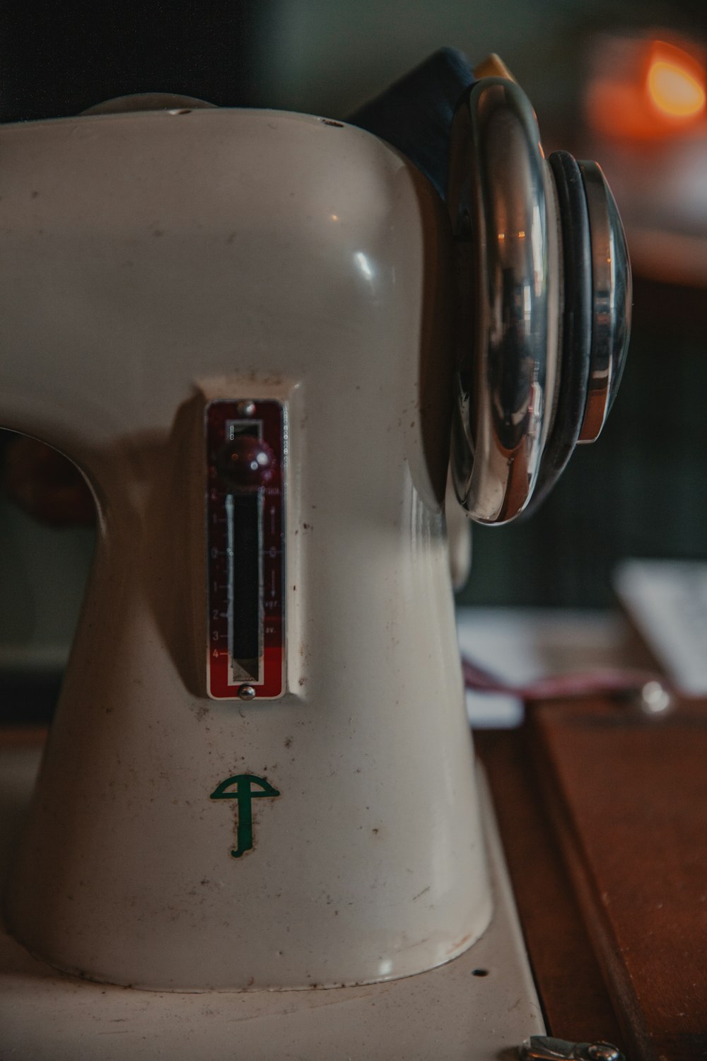 a close up of a white sewing machine