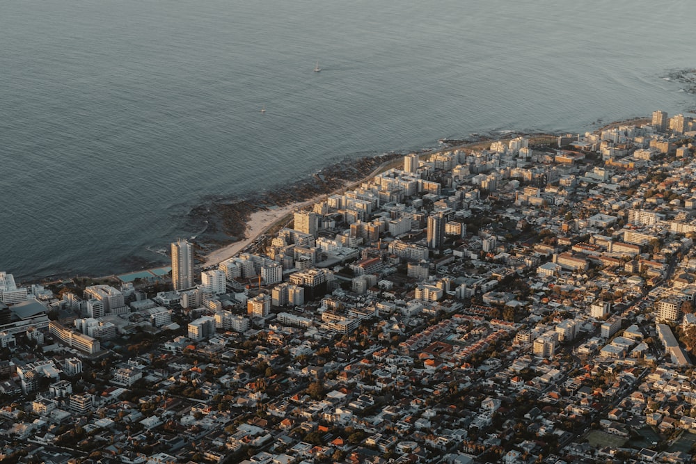 an aerial view of a city by the ocean