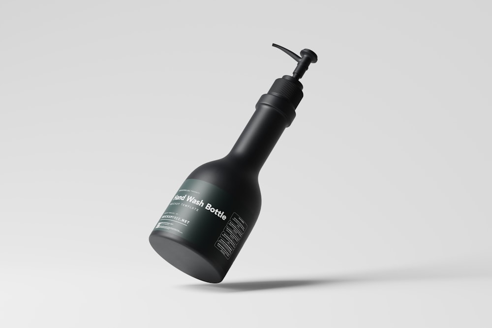 a black bottle with a black cap on a white background