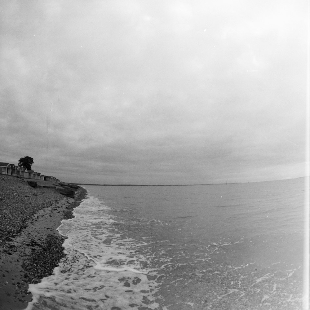 a black and white photo of a beach