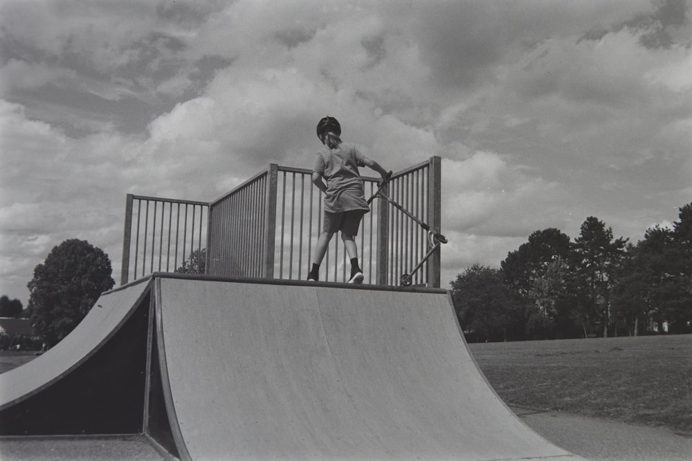 a man riding a skateboard up the side of a ramp