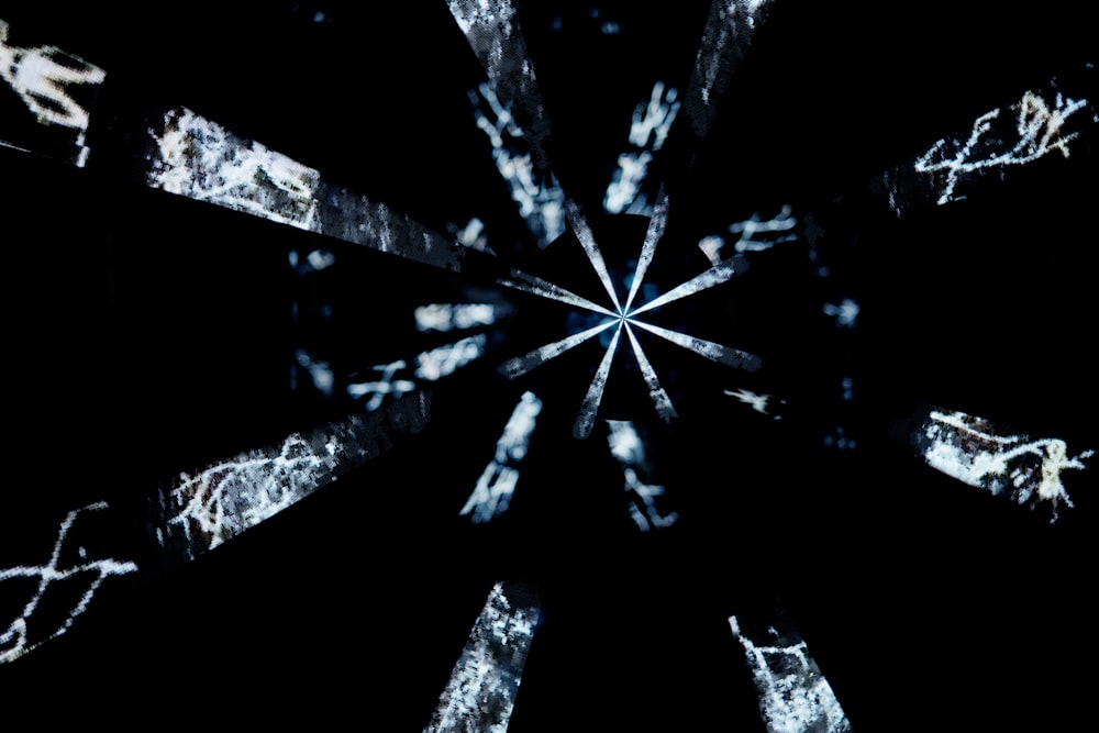 a black and white photo of a snowflake