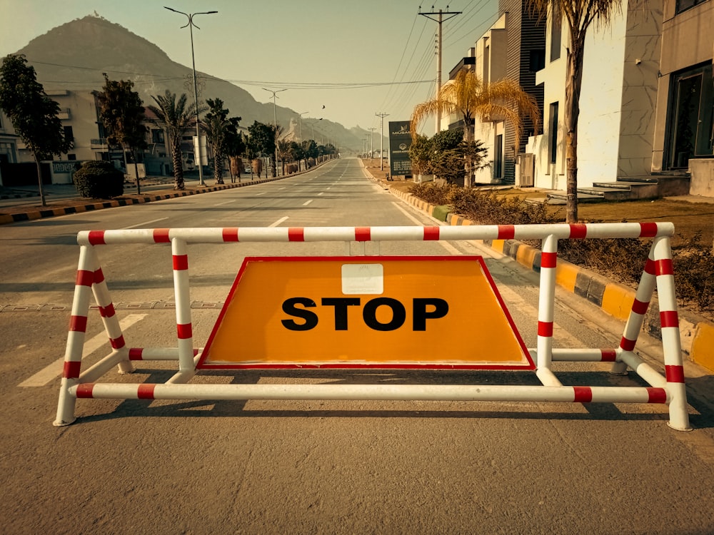 a barricade on a street with a stop sign on it