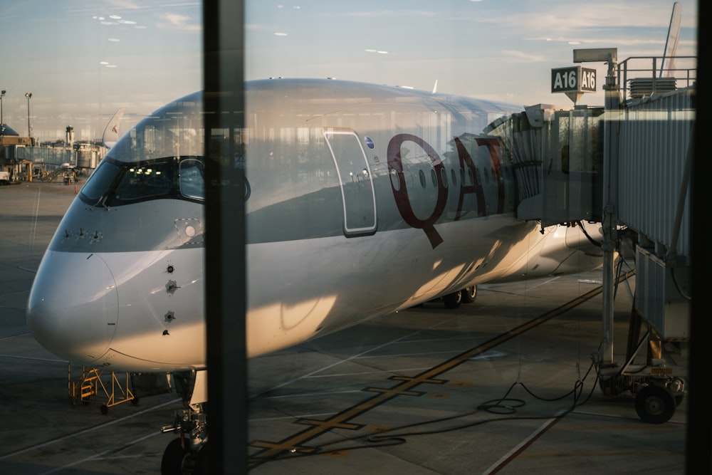 a large passenger jet sitting on top of an airport tarmac