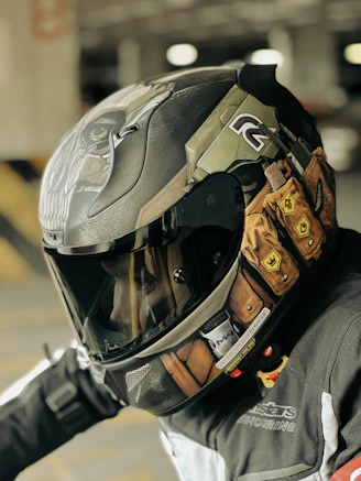 a man wearing a helmet and holding his arm out