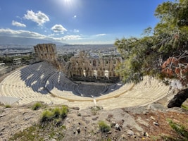 a view of a roman amphit from the top of a hill