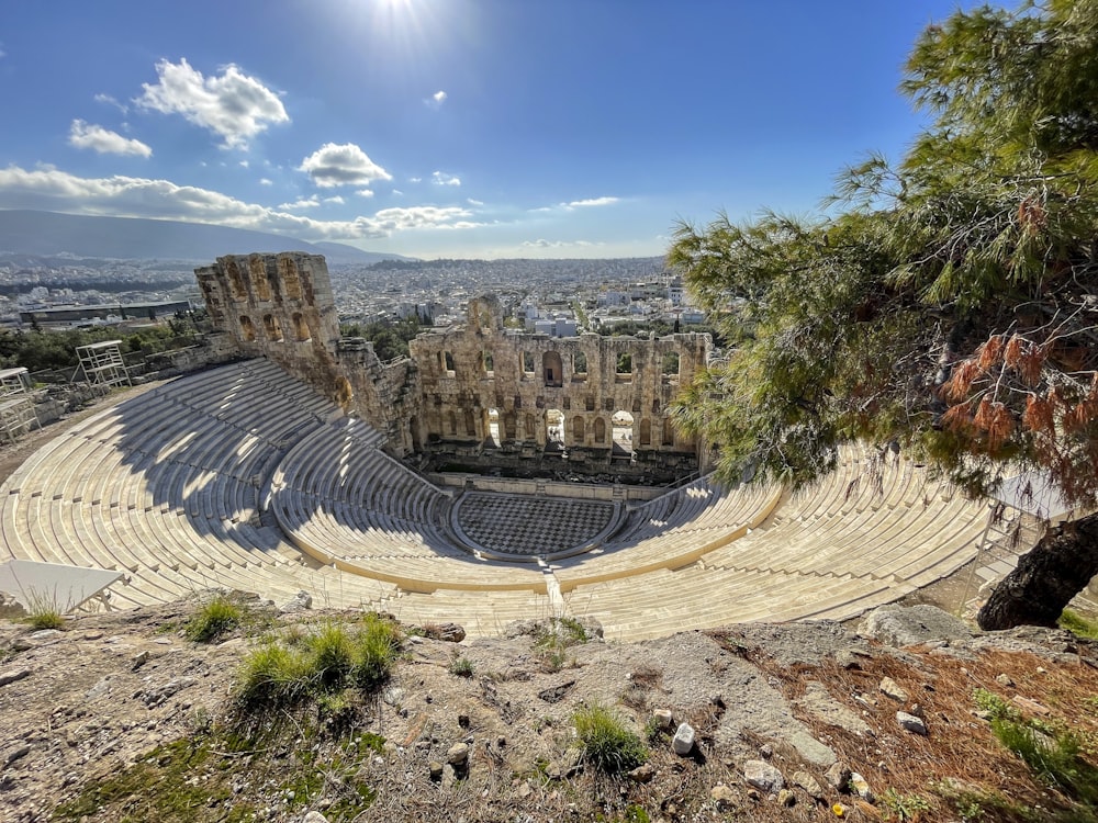 a view of a roman amphit from the top of a hill