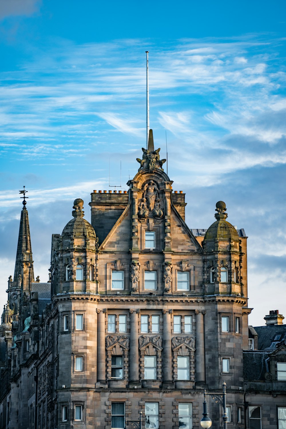 a tall building with a clock on the top of it